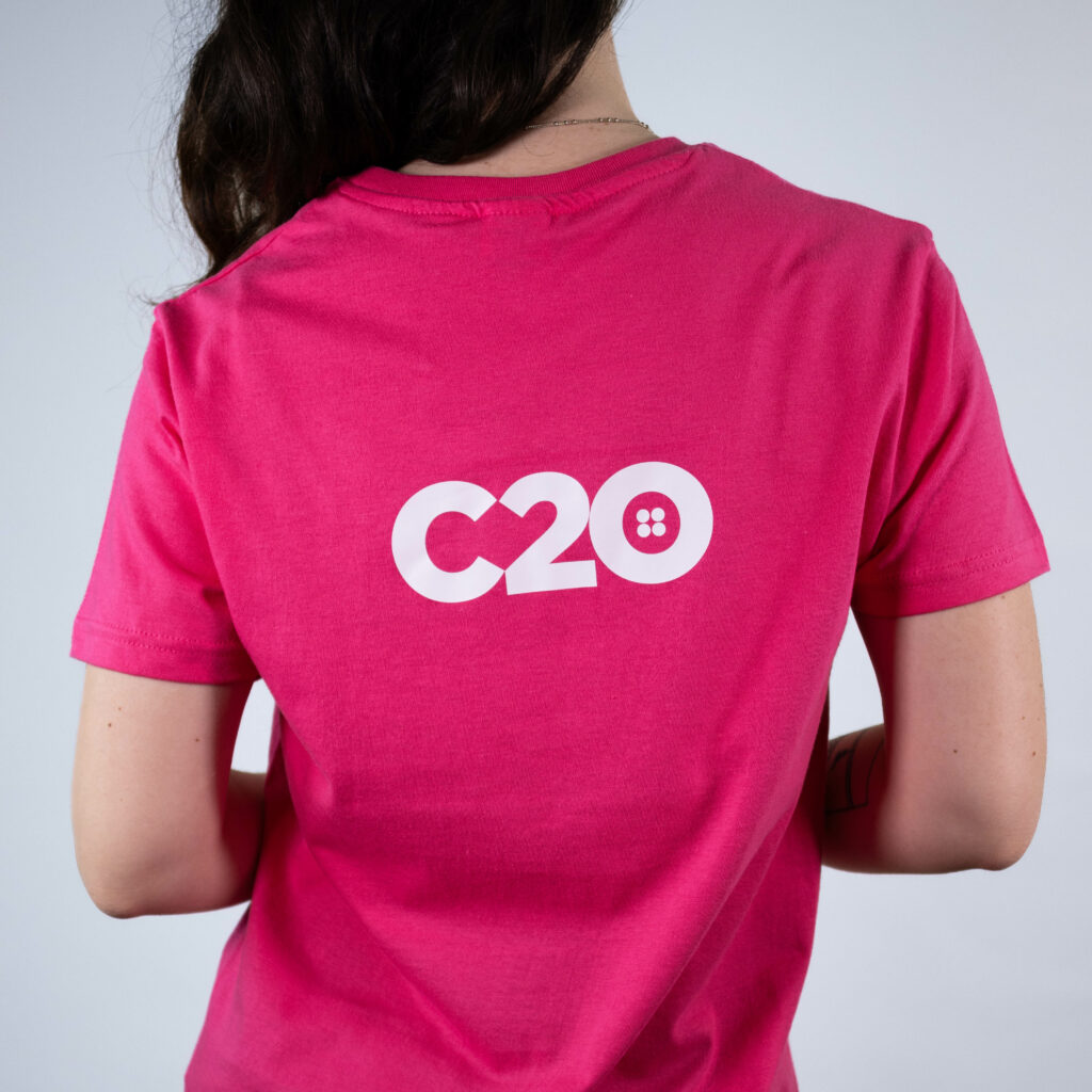 Pink t-shirt featuring Shoulder Blades logo placement.