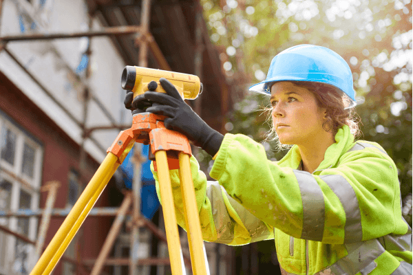 A women in a hard hat and hivis vest